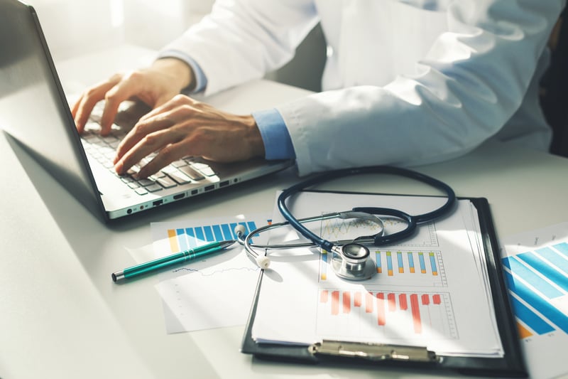 Doctor Typing at Computer